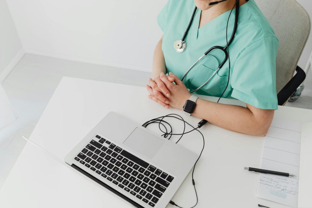 a doctor using a laptop